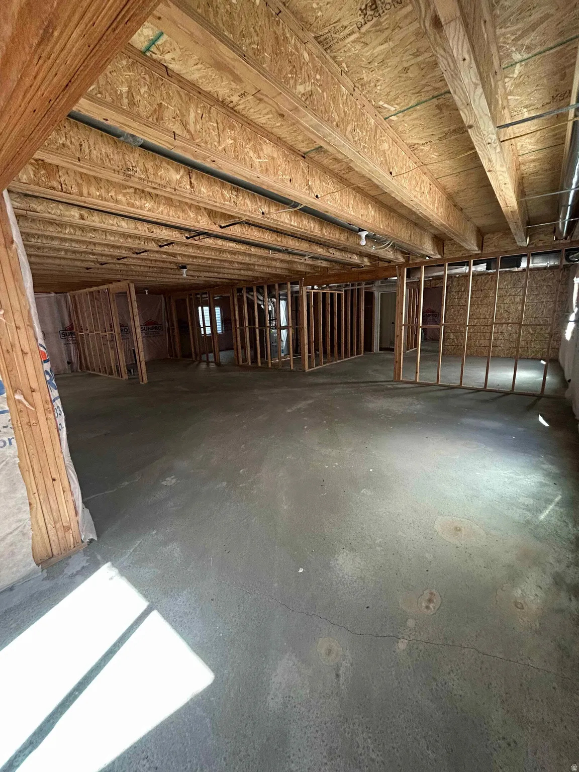 Miscellaneous room with concrete floors