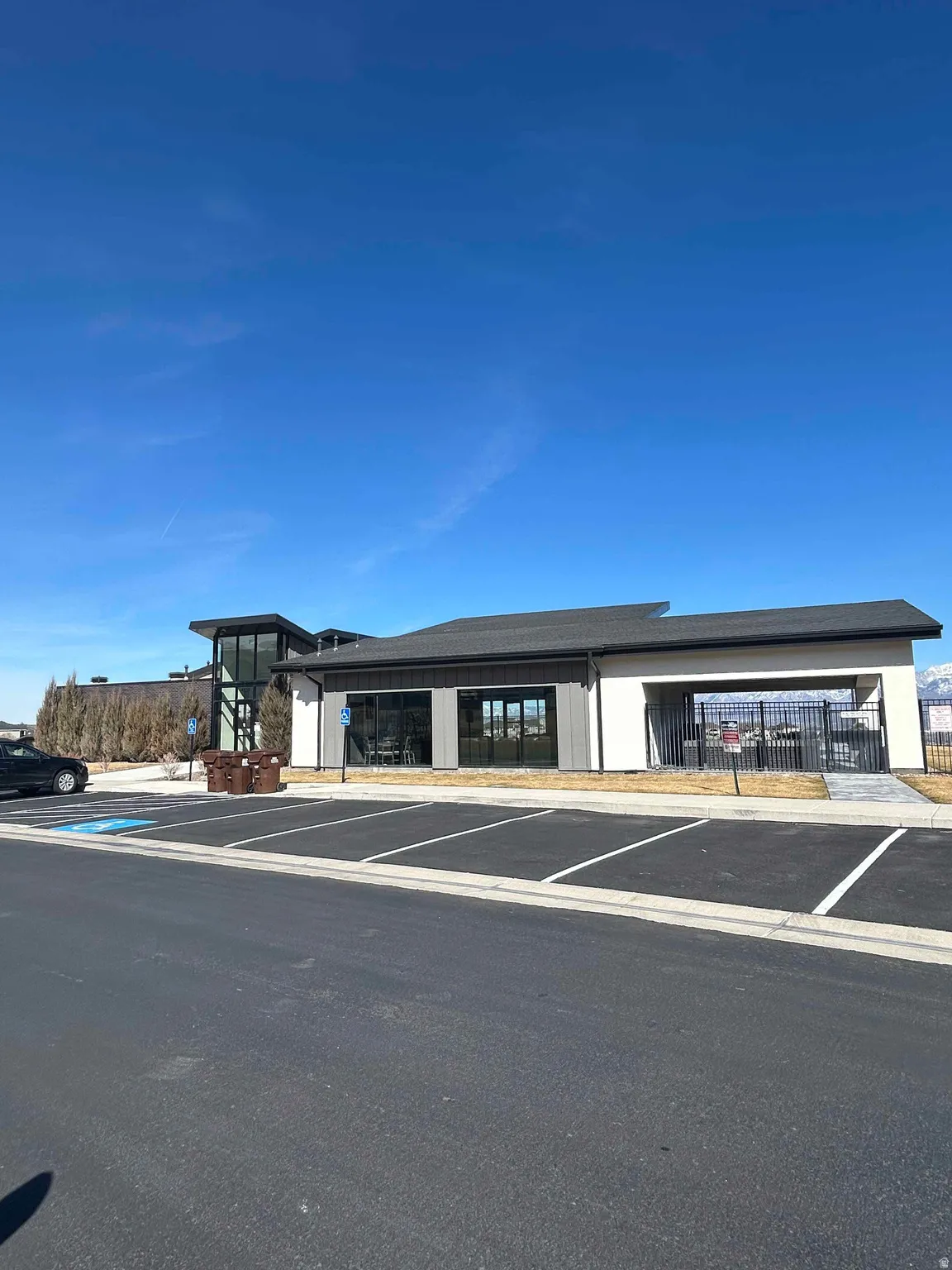 View of property with uncovered parking