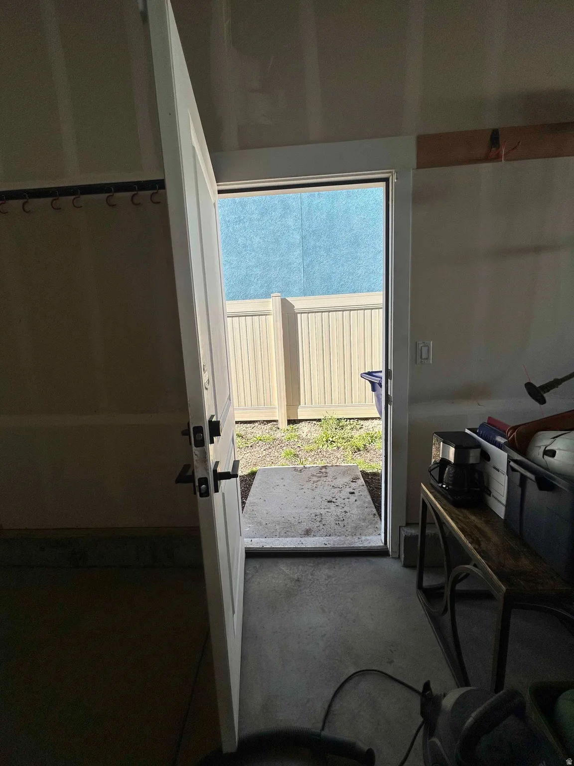 Entryway featuring unfinished concrete flooring