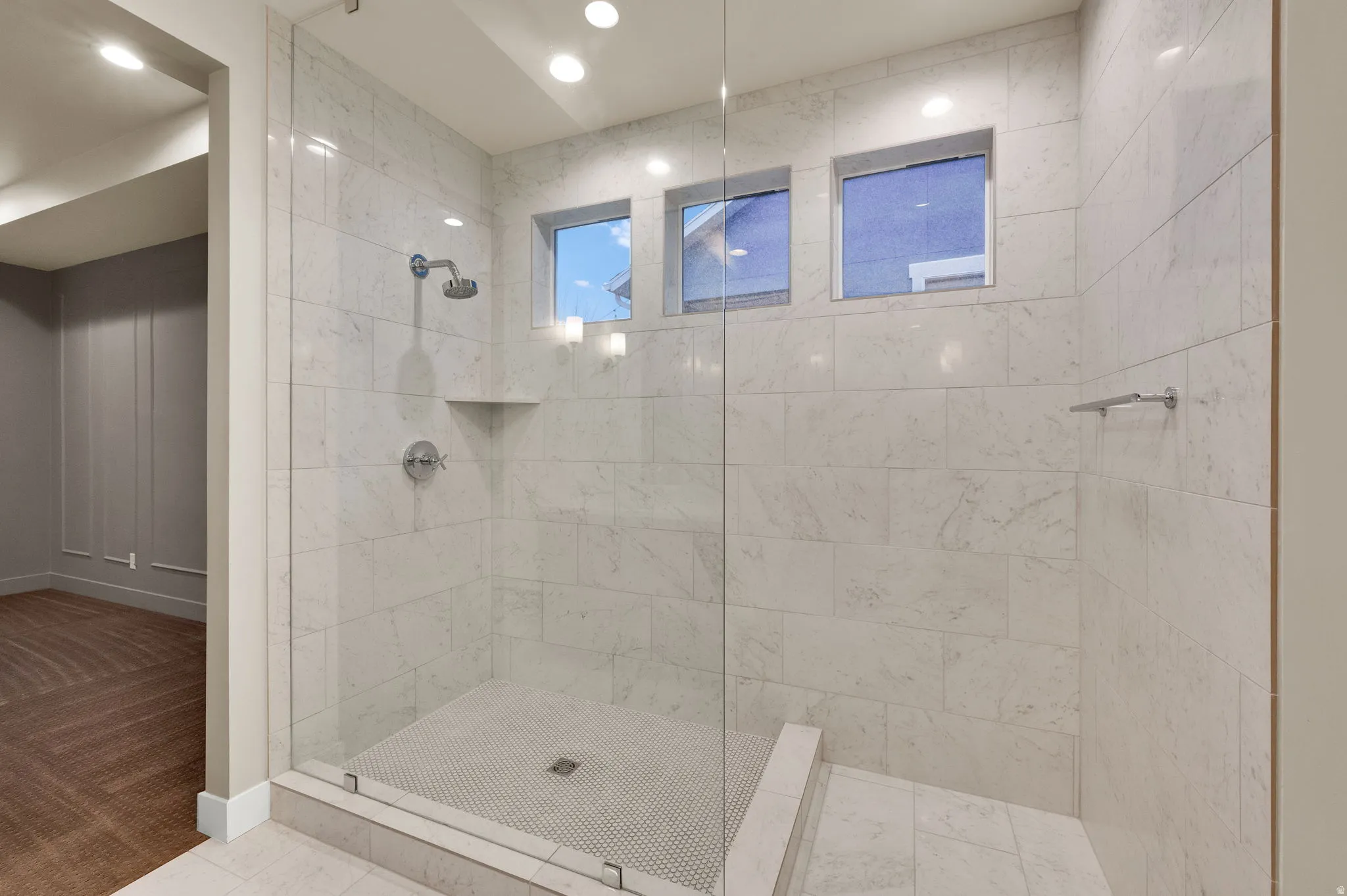 Full bathroom featuring a walk in shower and carpet floors