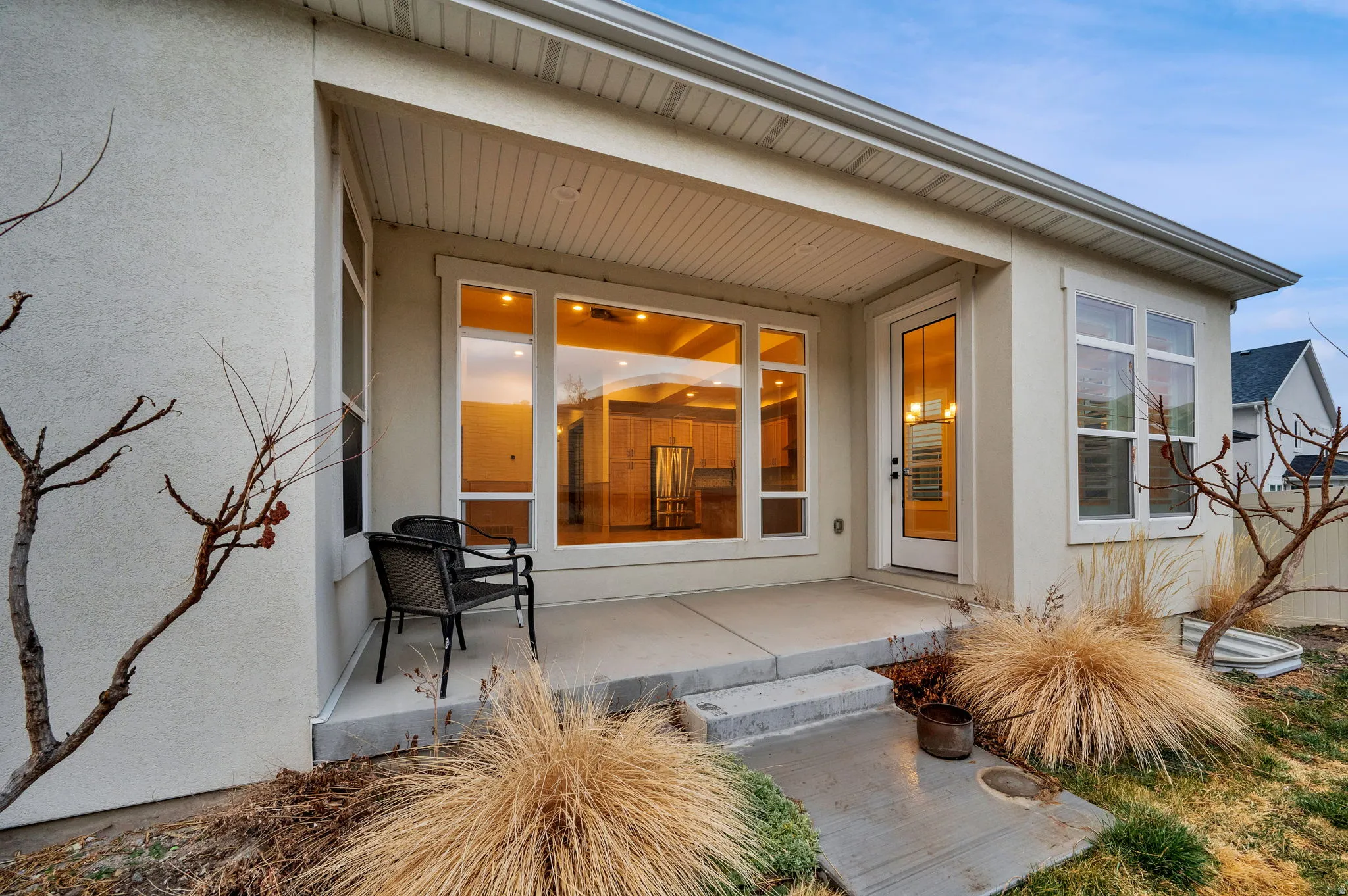 Property entrance featuring stucco siding