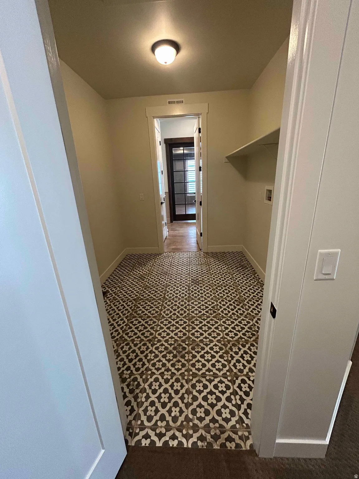 Hall featuring baseboards