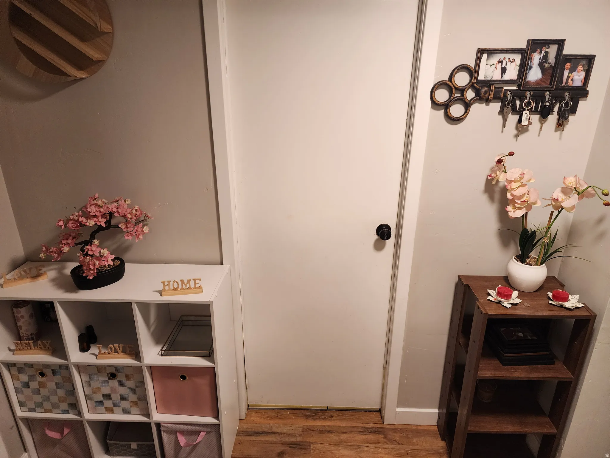 Doorway featuring wood finished floors and baseboards