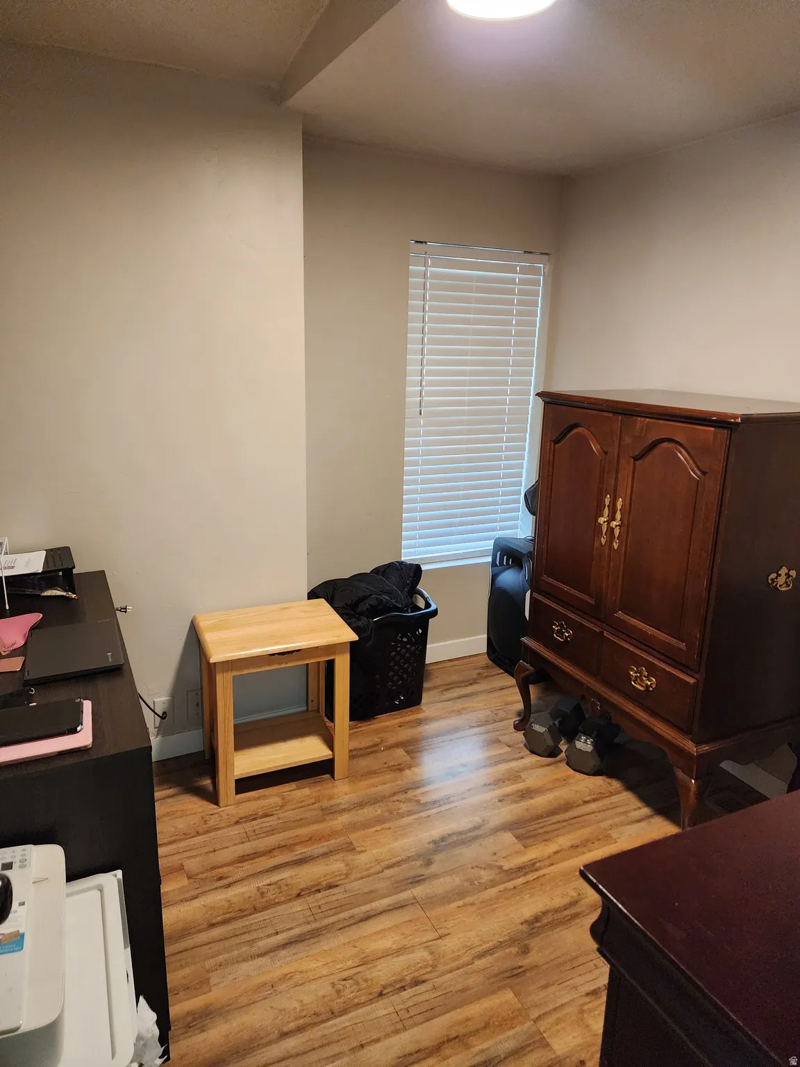 Office with light wood finished floors and baseboards