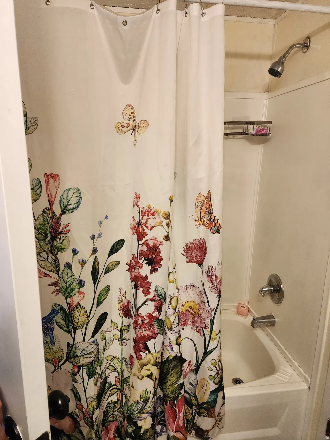 Full bathroom with shower / tub combo with curtain