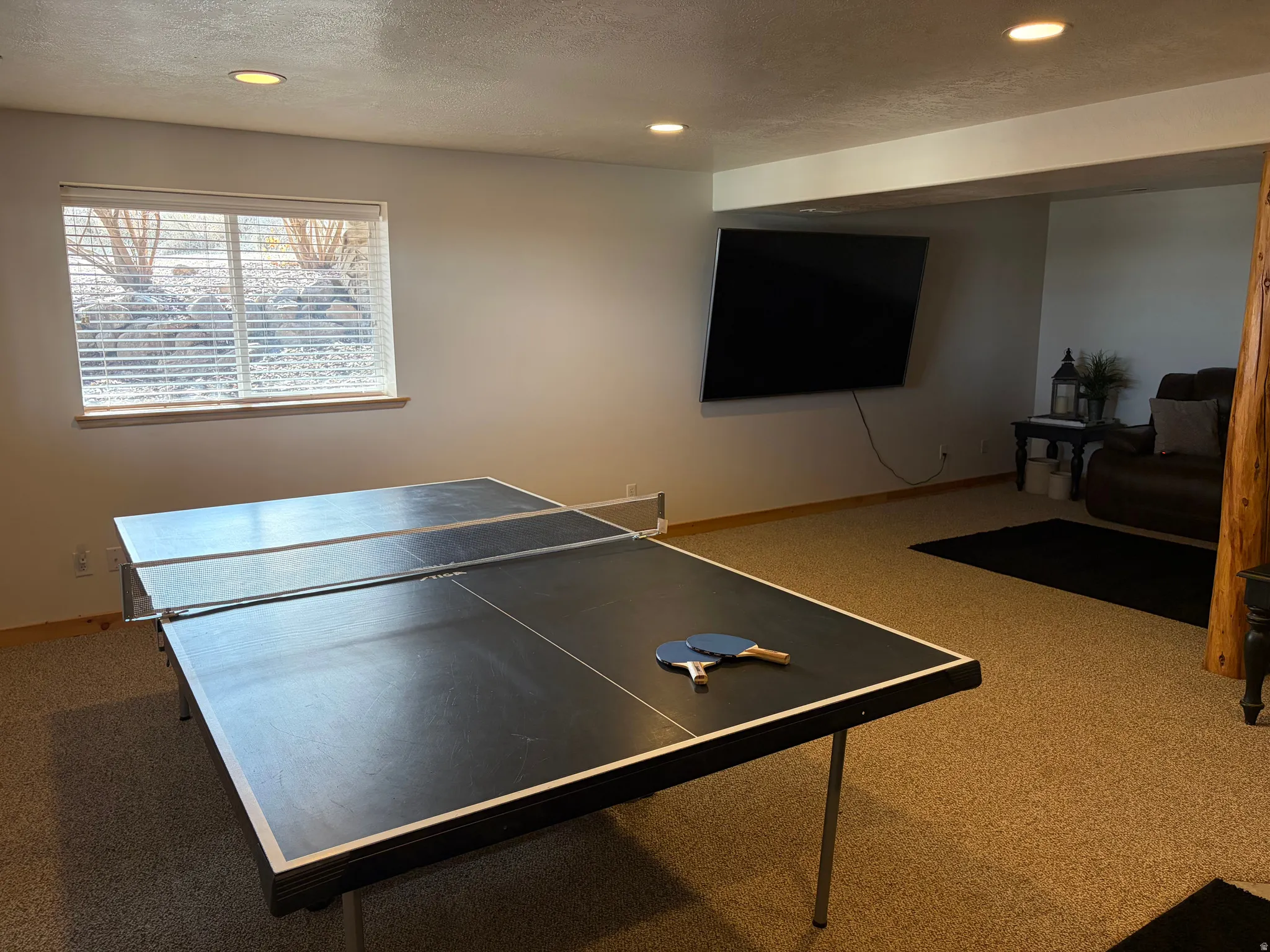Recreation room featuring carpet flooring and recessed lighting