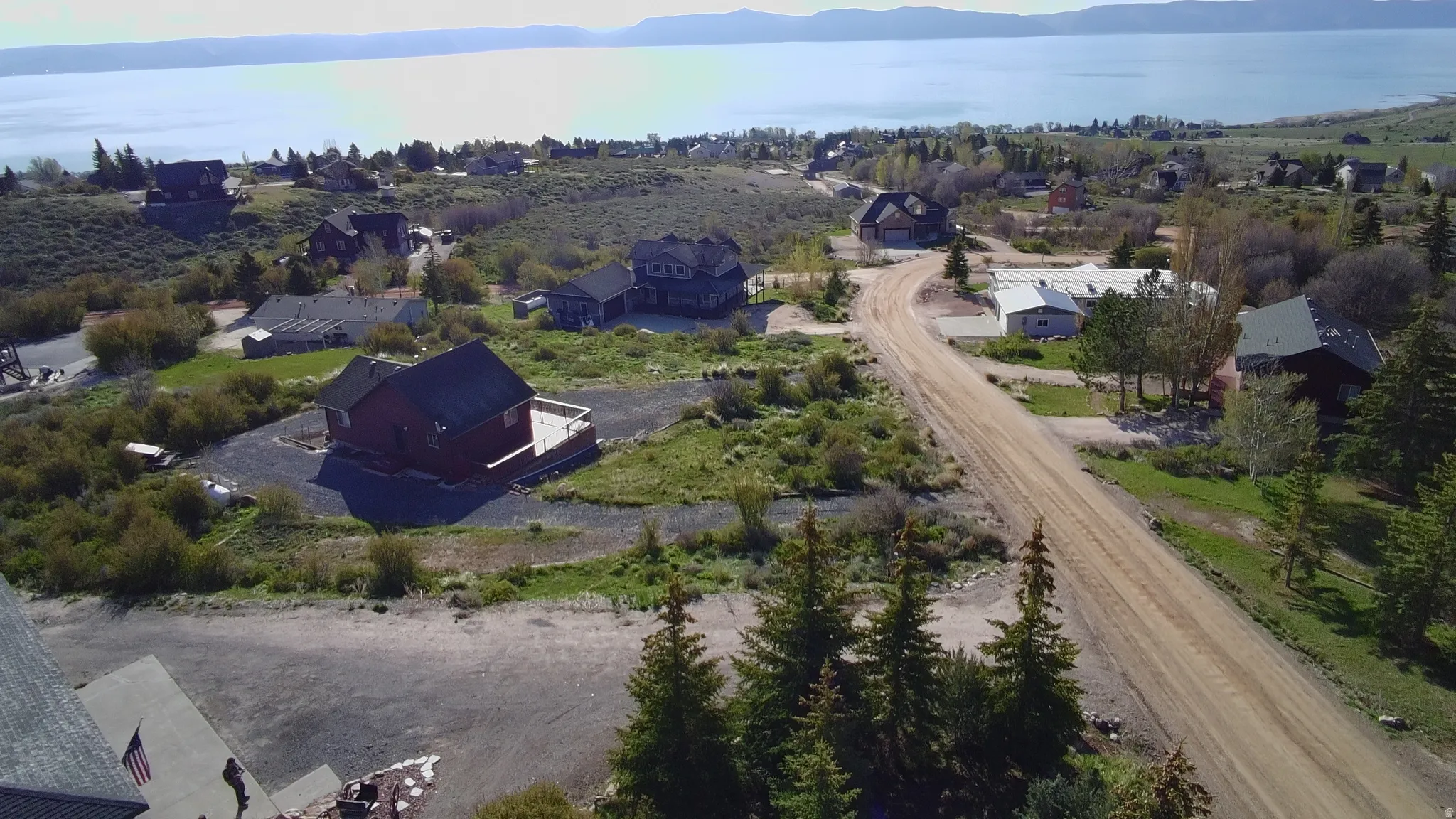 Elevated property offering a distant lake backdrop and surrounding mountain terrain