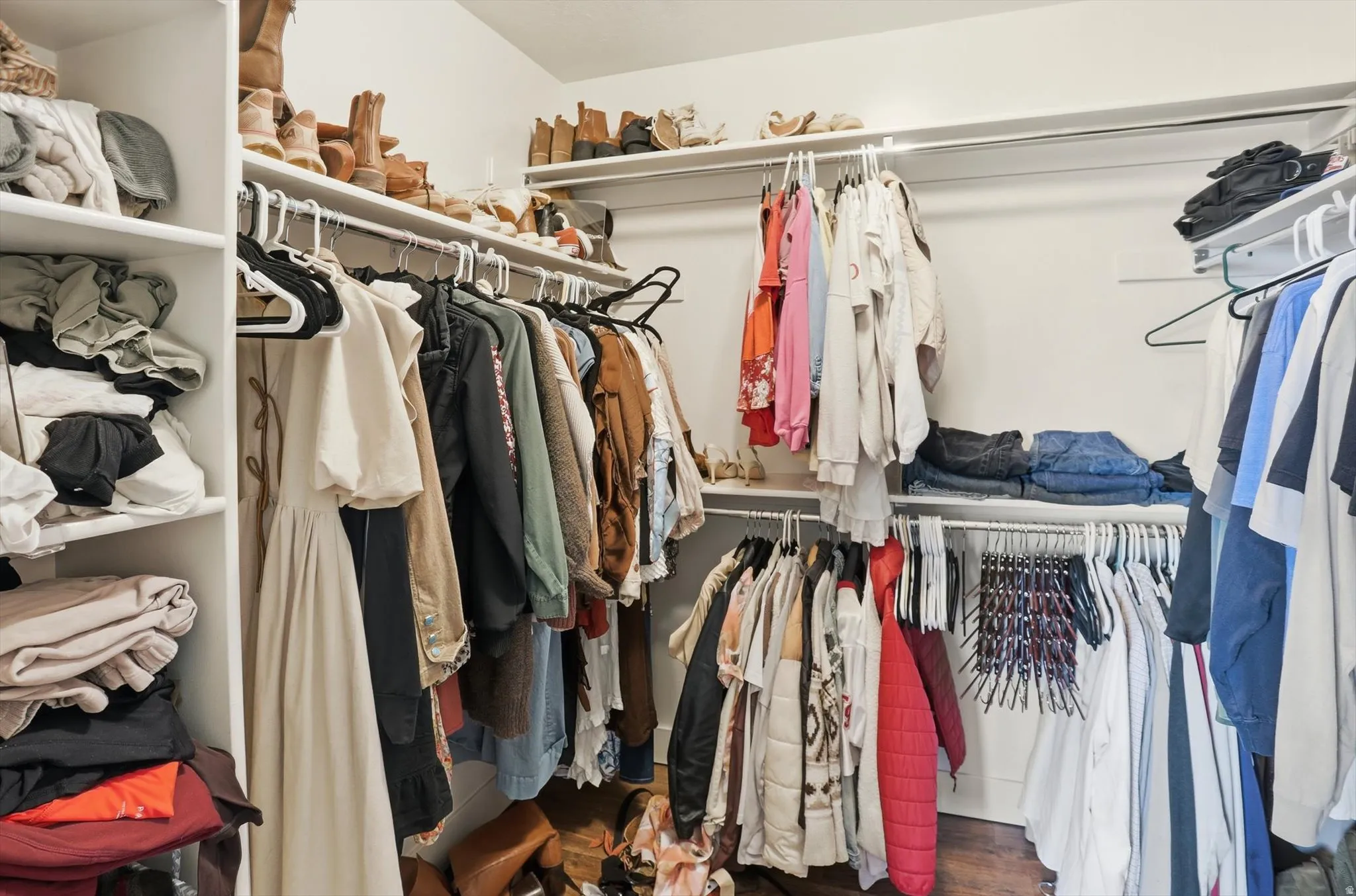 Walk in closet featuring wood finished floors
