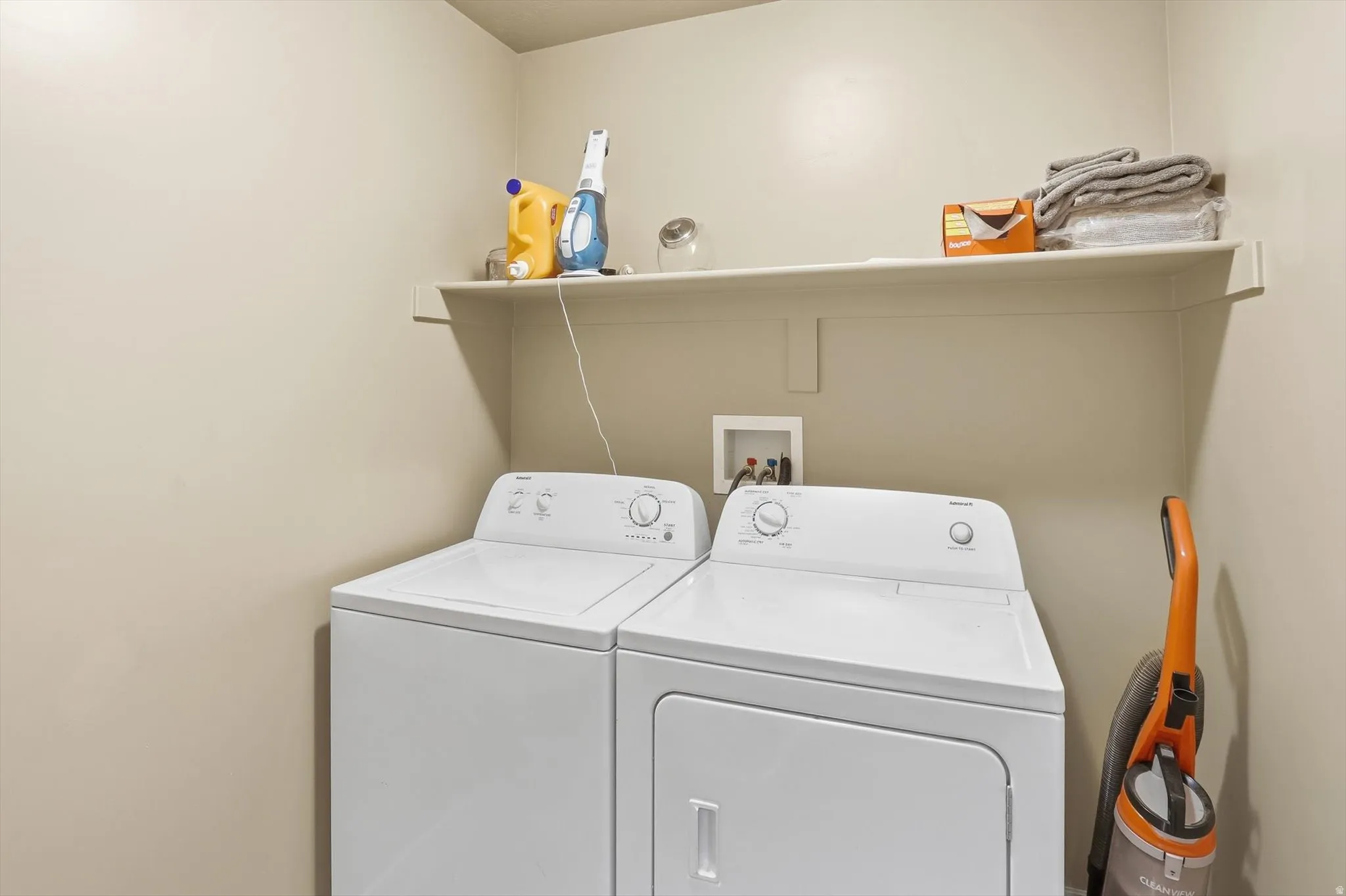 Laundry room featuring independent washer and dryer