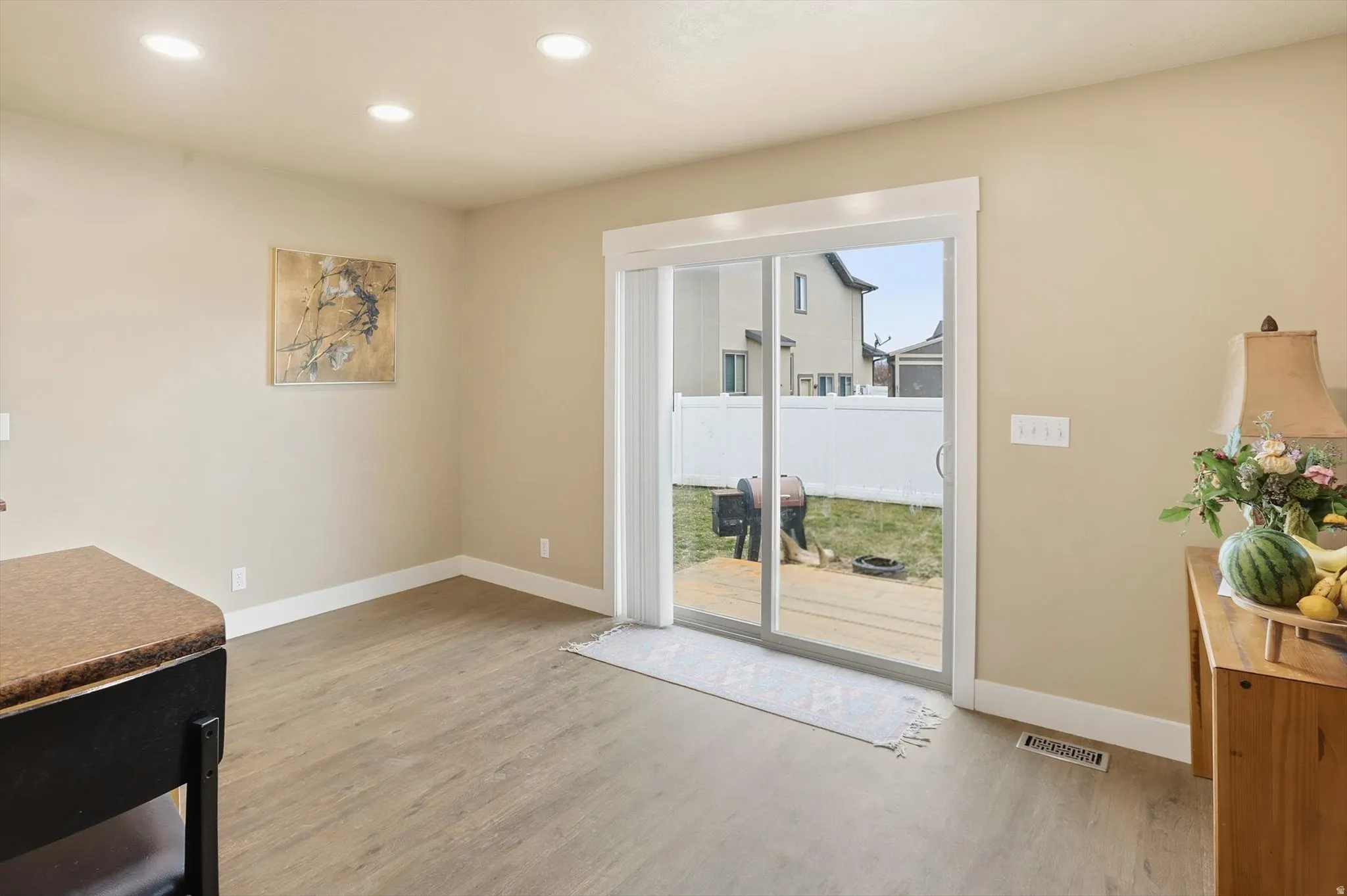 Dining space featuring light wood-type flooring and recessed lighting