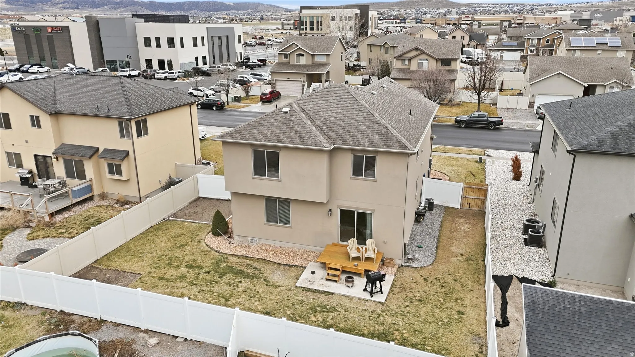Aerial perspective of suburban area with a mountain backdrop