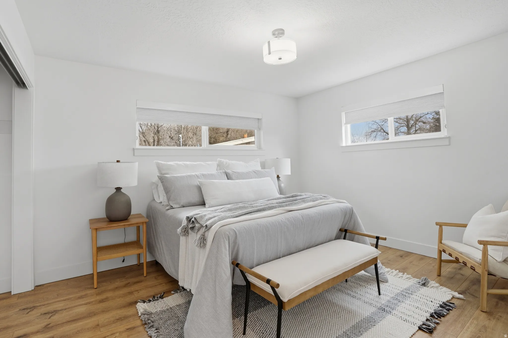 Upstairs Bedroom featuring light wood-style flooring and a closet