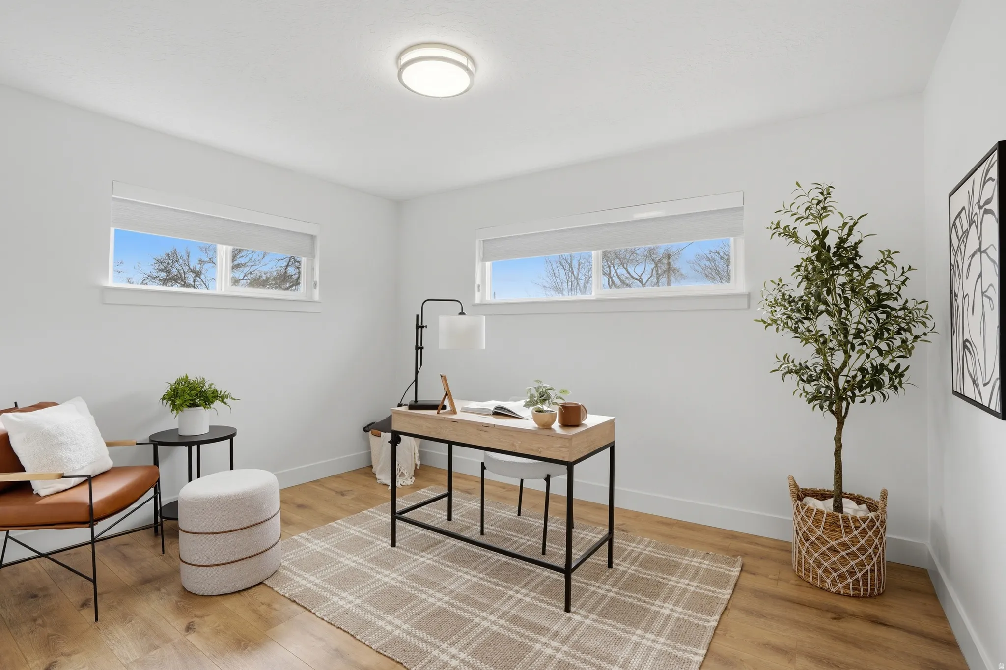 Upstairs Office area featuring light wood-type flooring and healthy amount of natural light