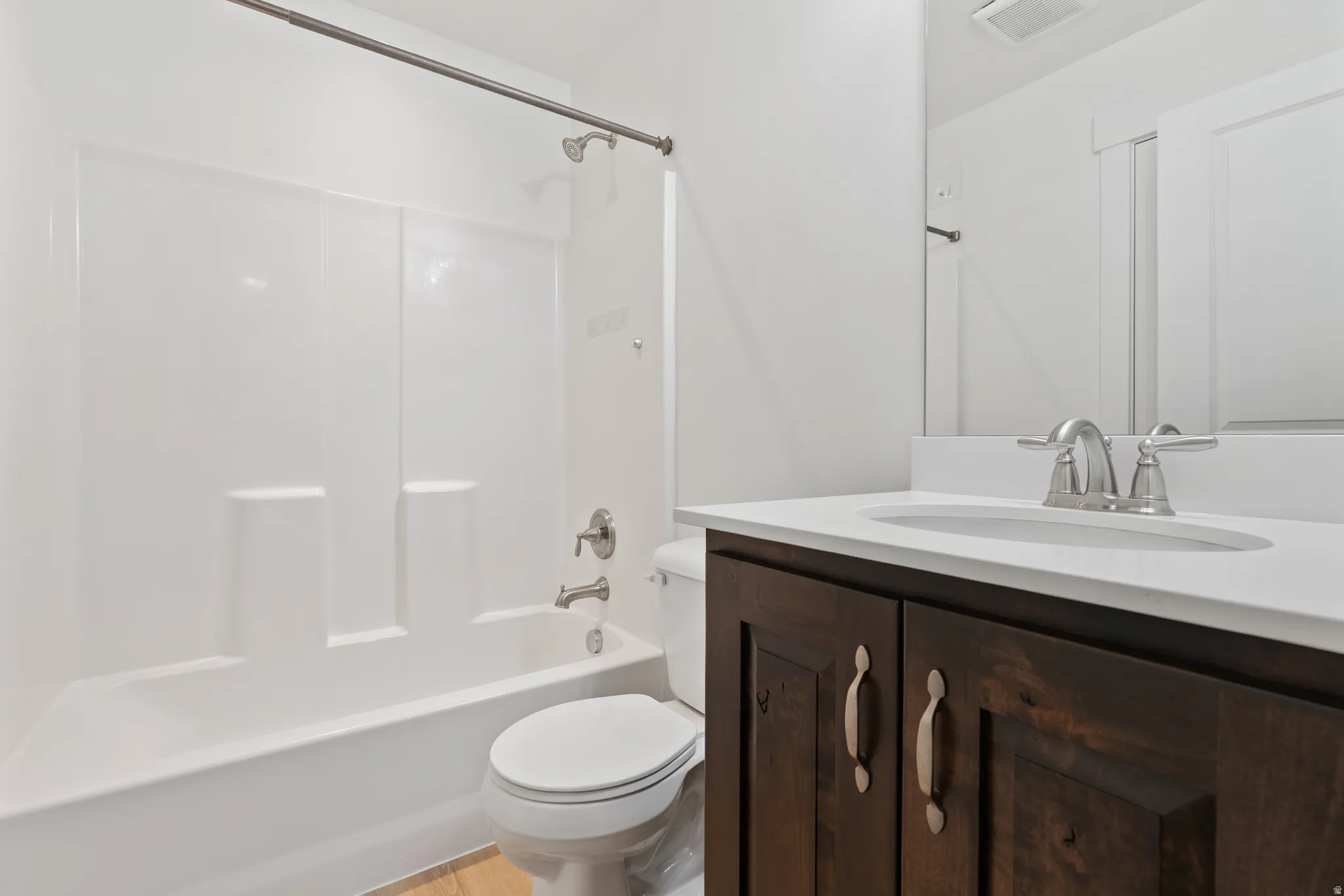 Full bathroom featuring vanity and bathing tub / shower combination