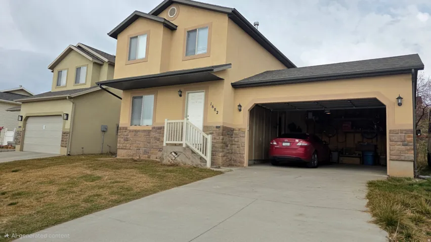 Traditional-style house with stucco siding, stone siding, a front yard, concrete driveway, and roof with shingles