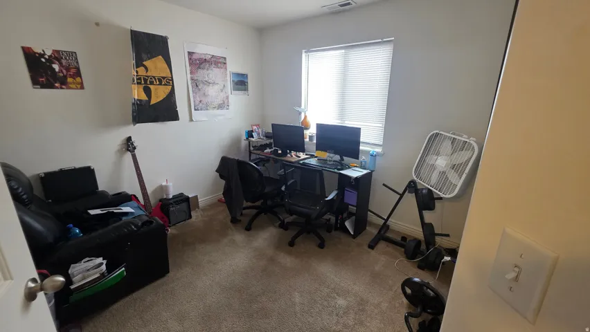 Office featuring carpet floors and baseboards