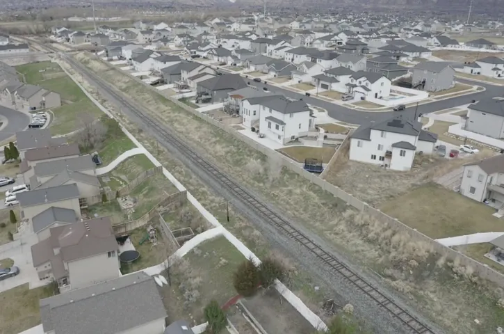 Aerial overview of property's location featuring nearby suburban area