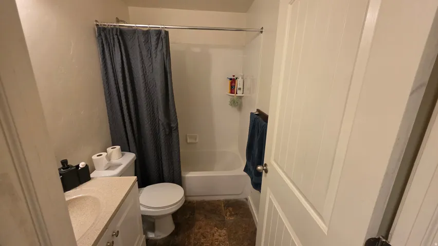 Full bathroom featuring vanity and shower / tub combo