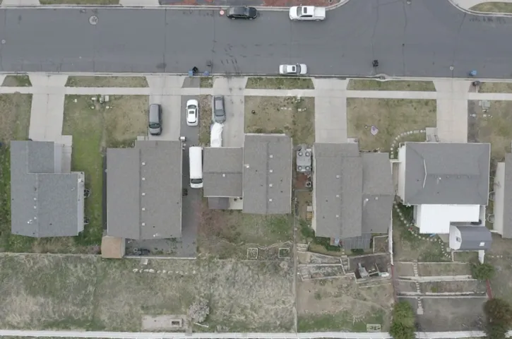Aerial view of property's location featuring nearby suburban area