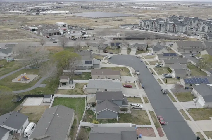Aerial view of property's location featuring nearby suburban area