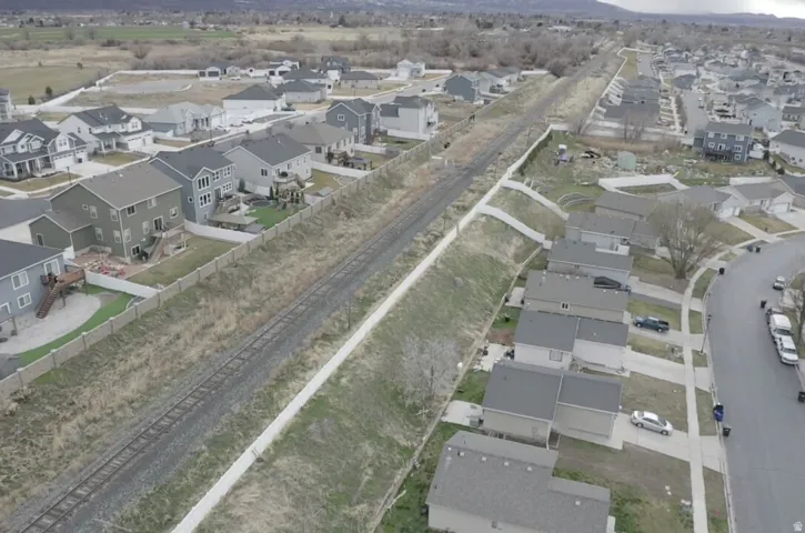 Aerial view of property's location featuring nearby suburban area