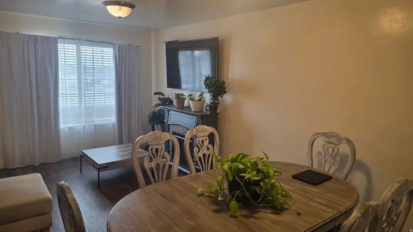 Dining area with wood-type flooring