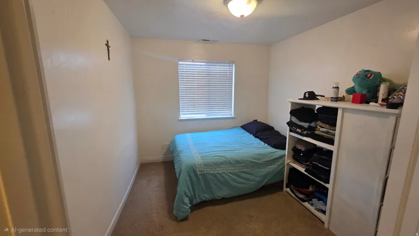 Bedroom featuring dark carpet