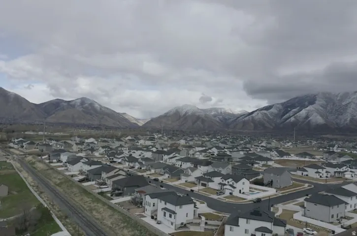 View of mountain background featuring nearby suburban area
