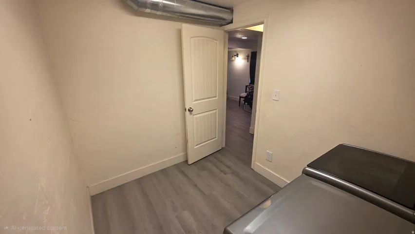 Interior space featuring dark wood finished floors and baseboards