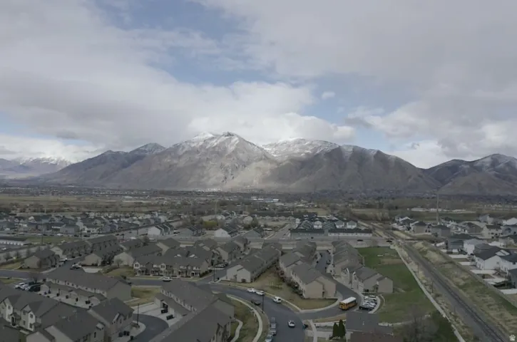 View of mountain background featuring nearby suburban area