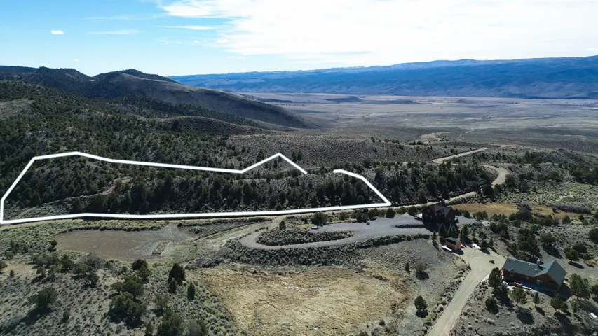 Aerial view of property's location with mountains and property boundaries highlighted
