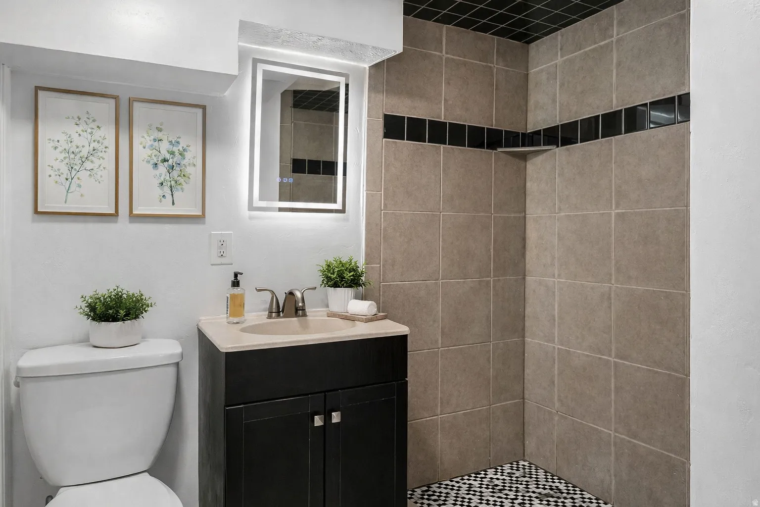 Full bath with vanity and a shower