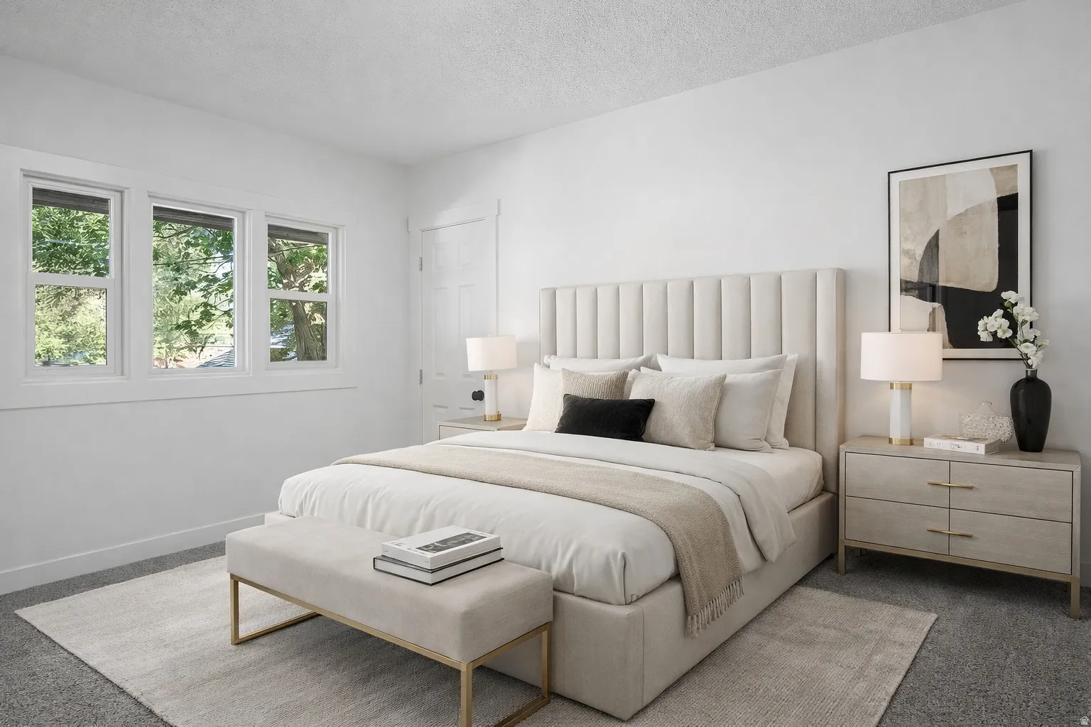 Carpeted bedroom with a textured ceiling