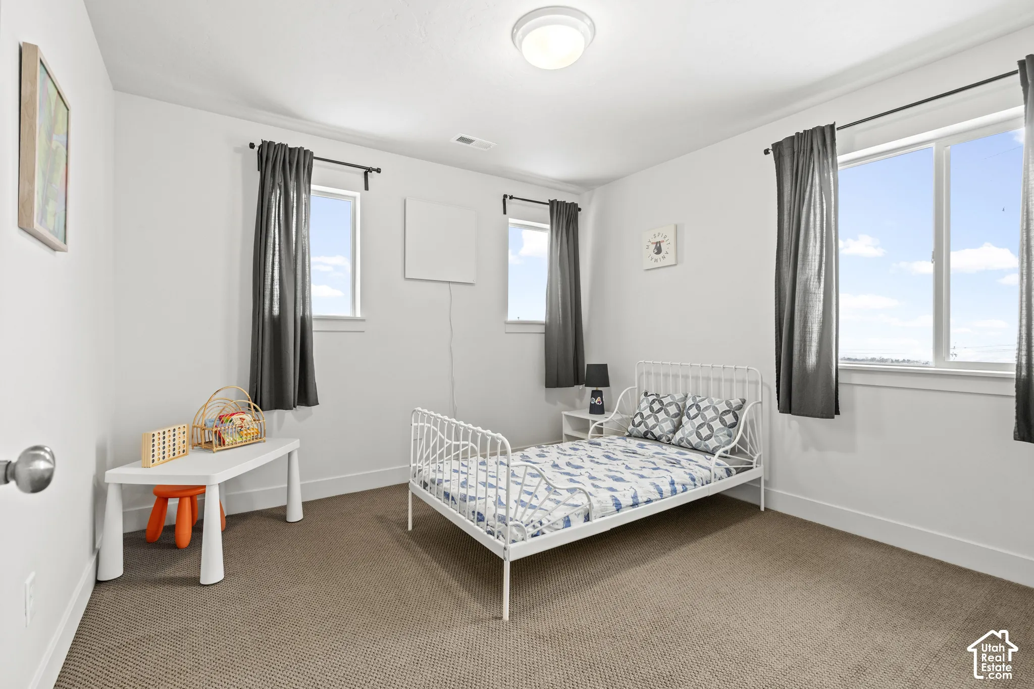 Carpeted bedroom with baseboards