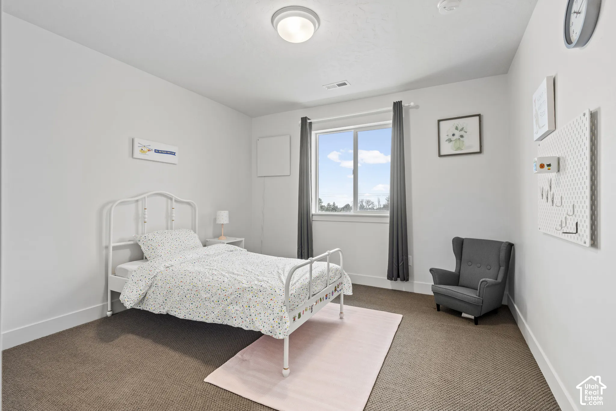 Carpeted bedroom with baseboards