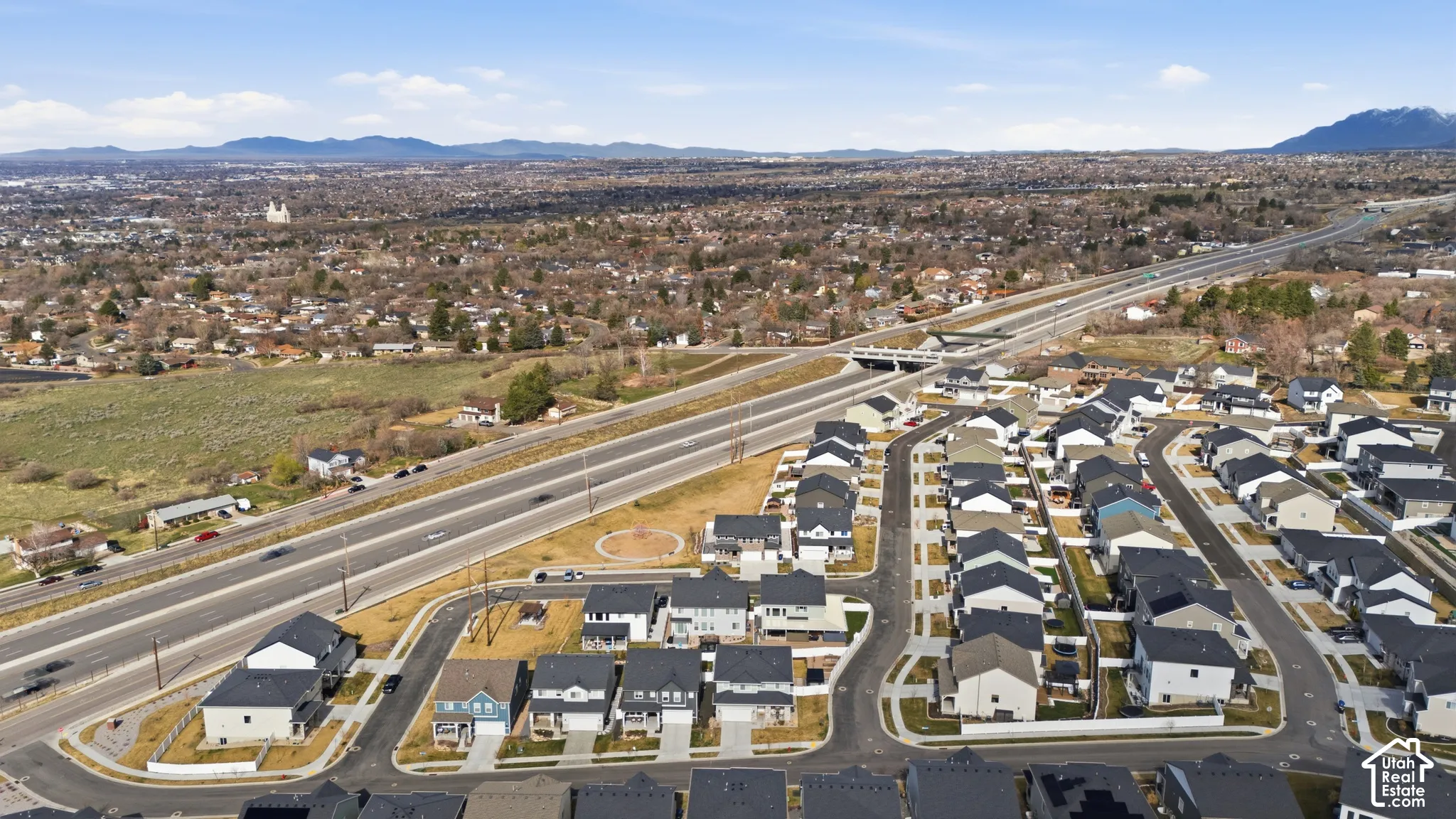 View of property location with nearby suburban area and mountains
