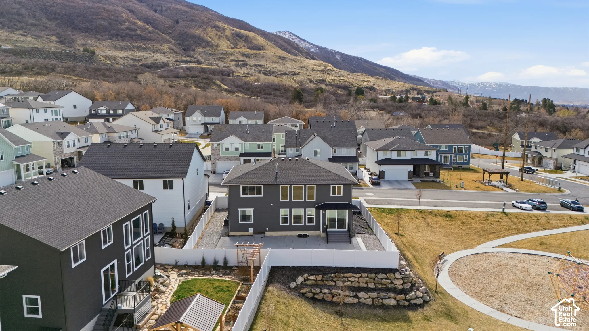 Aerial view of residential area featuring a mountain backdrop