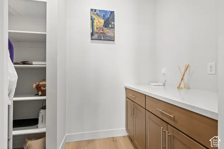 Butlers pantry featuring a countertop and storage shelves.