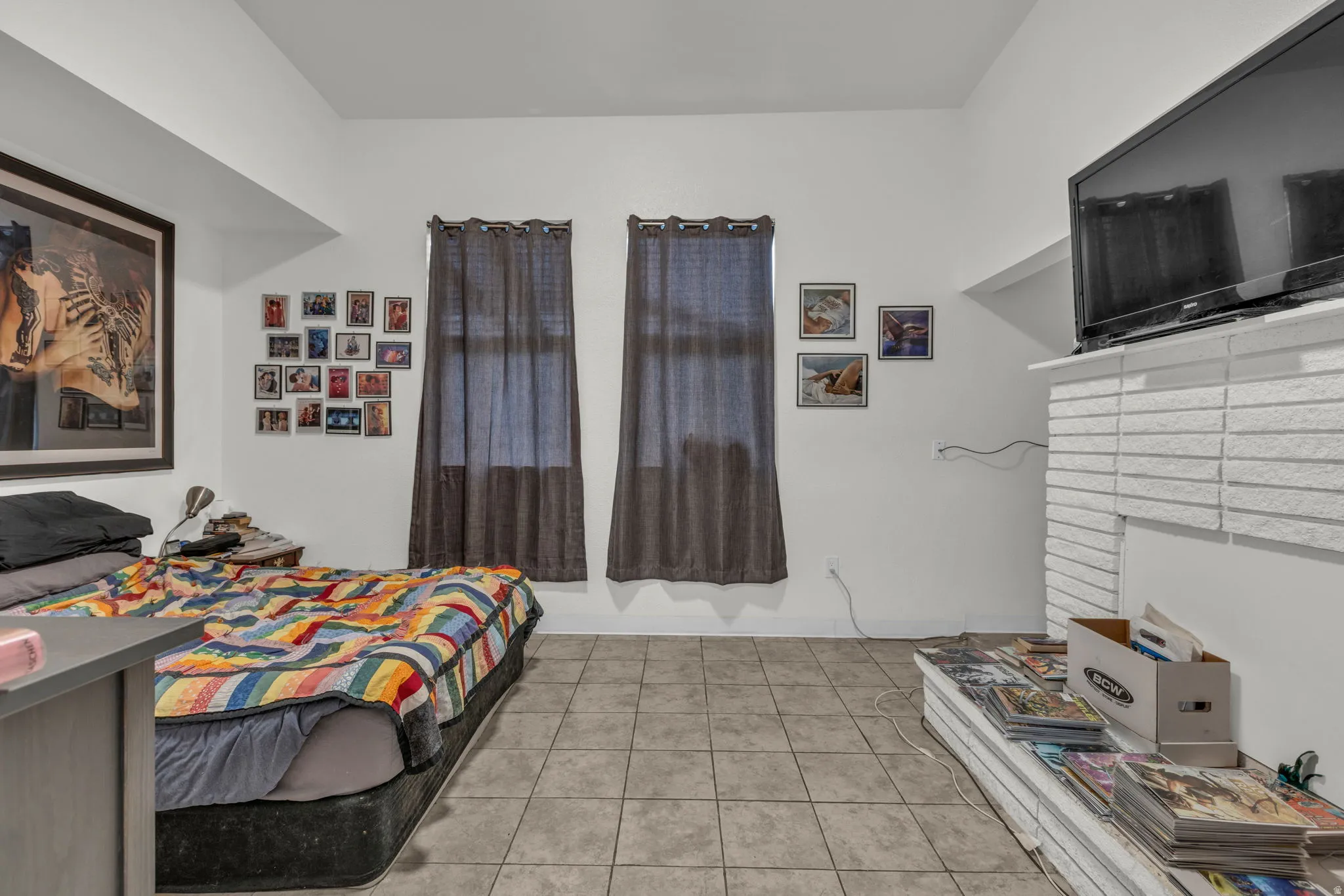Bedroom with light tile patterned flooring