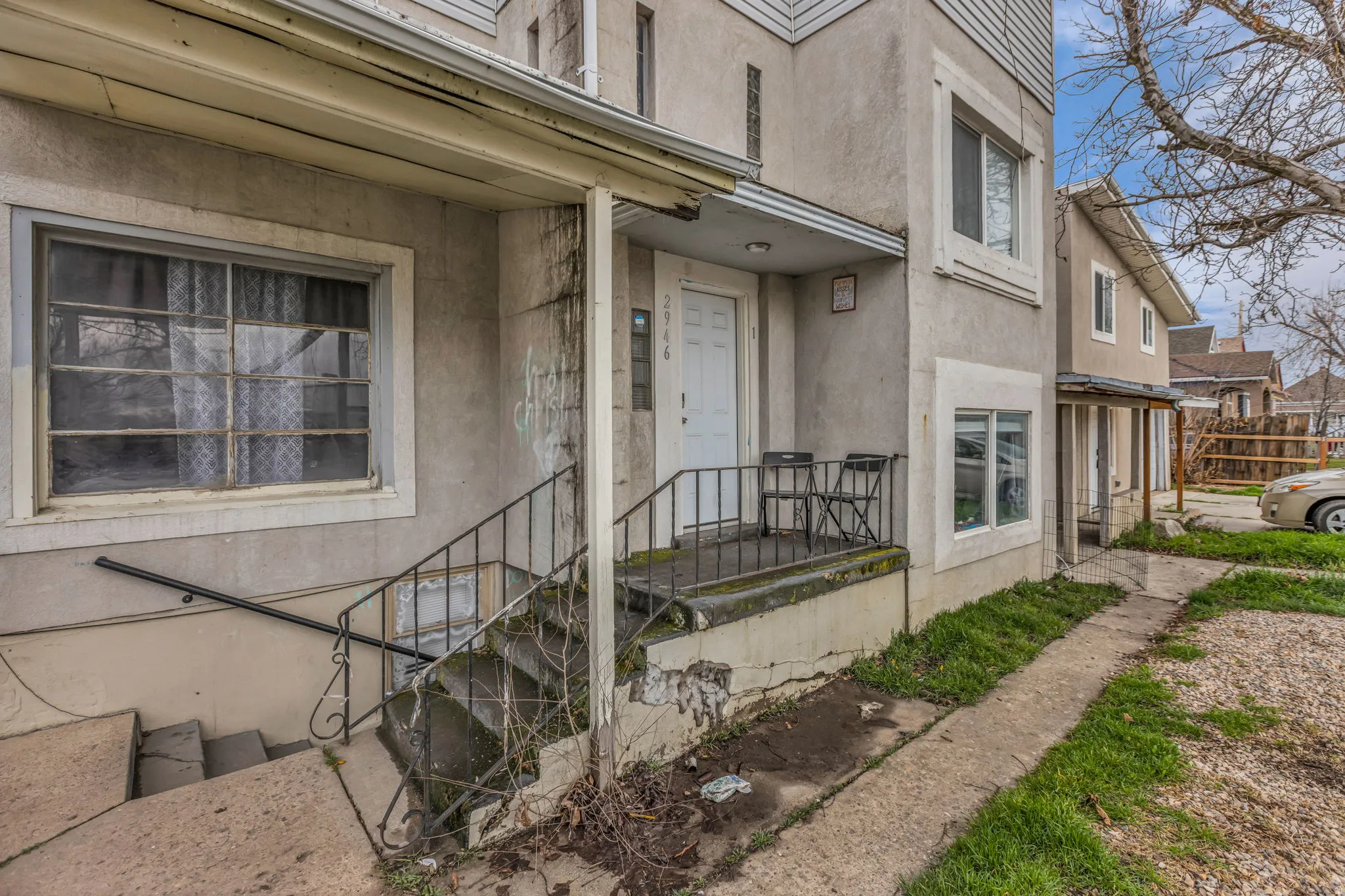 View of exterior entry featuring stucco siding