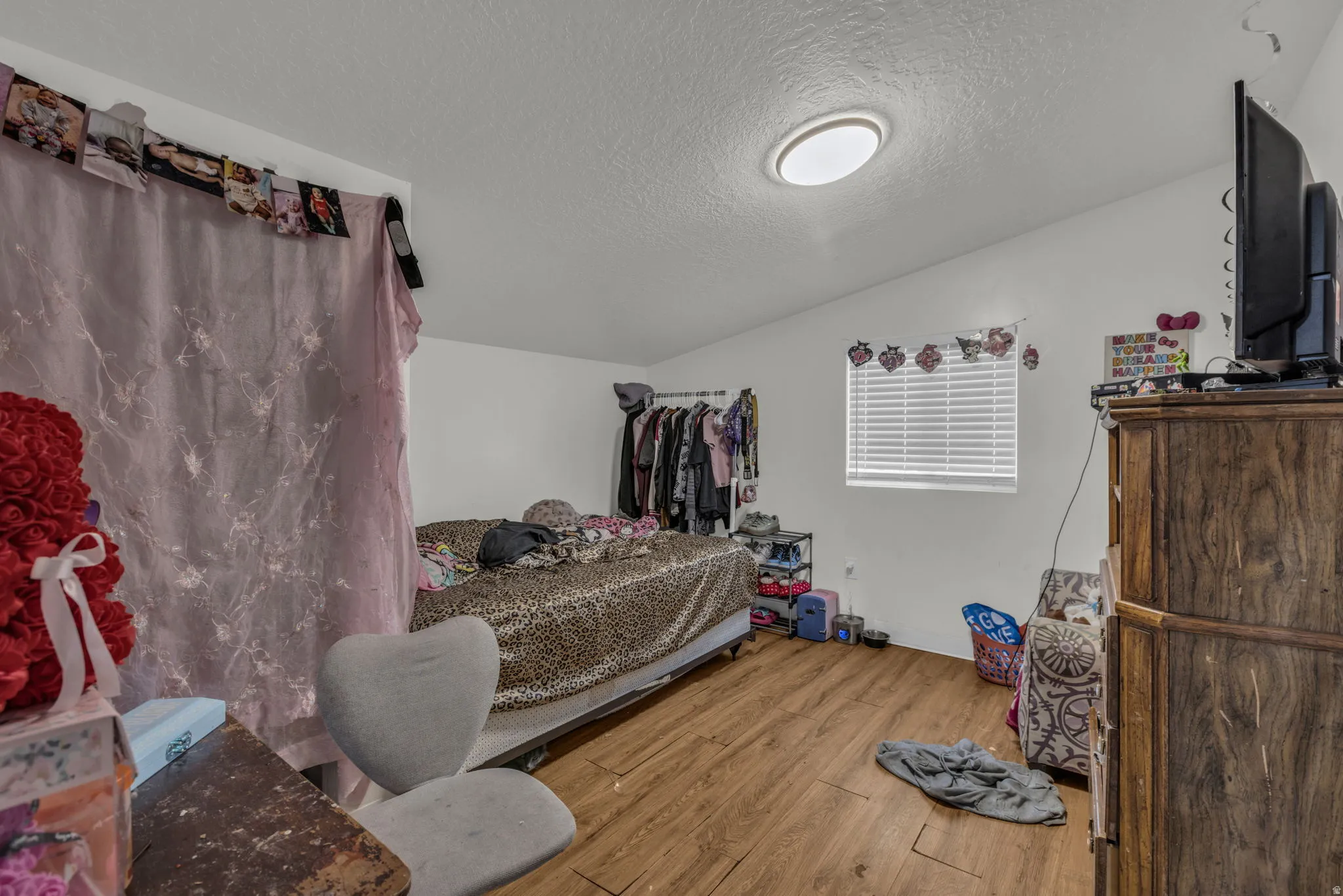 Bedroom with light wood finished floors