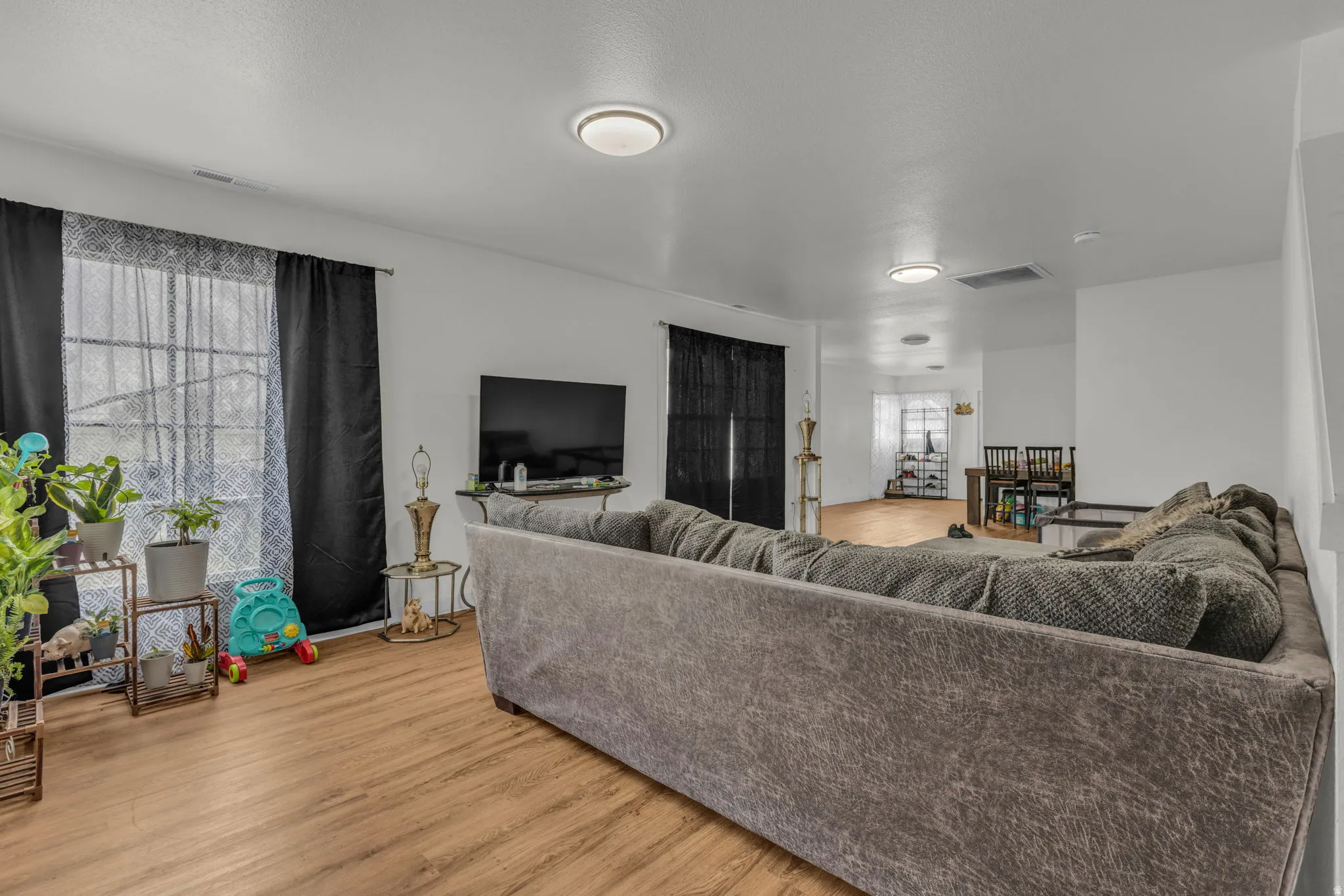Living area featuring light wood-type flooring and plenty of natural light