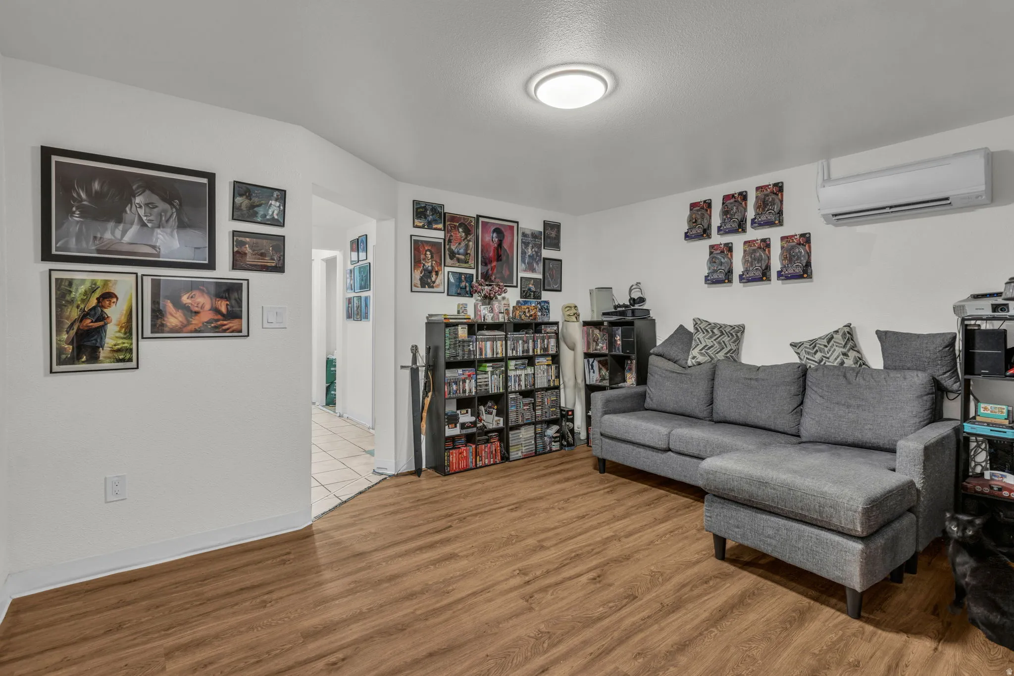 Living area featuring light wood-type flooring and a mini split for heating / cooling
