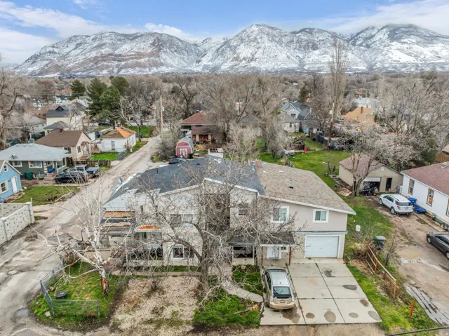 Aerial view of residential area featuring mountains