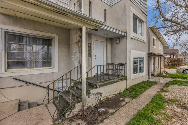 View of exterior entry featuring stucco siding