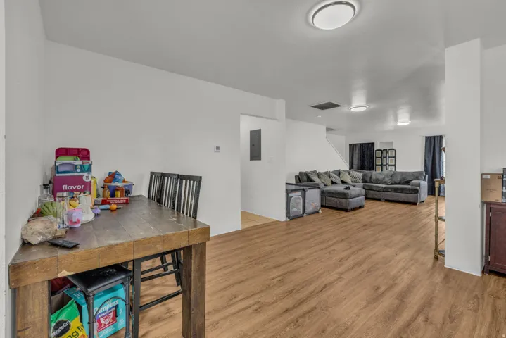 Dining room featuring light wood finished floors and electric panel