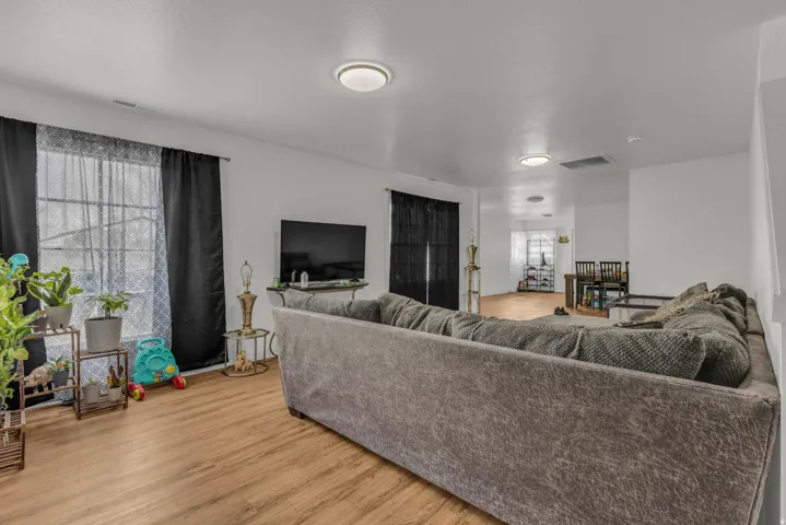 Living area featuring light wood-type flooring and plenty of natural light
