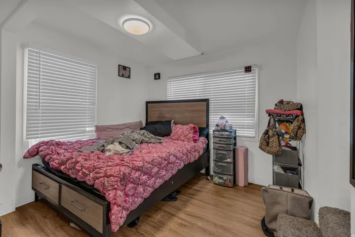 Bedroom with wood finished floors
