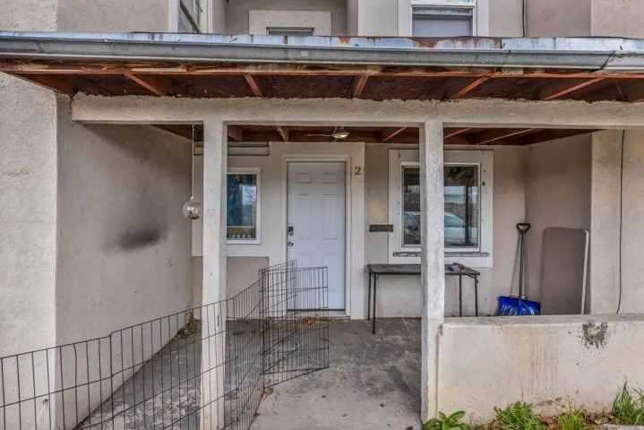 View of exterior entry featuring stucco siding