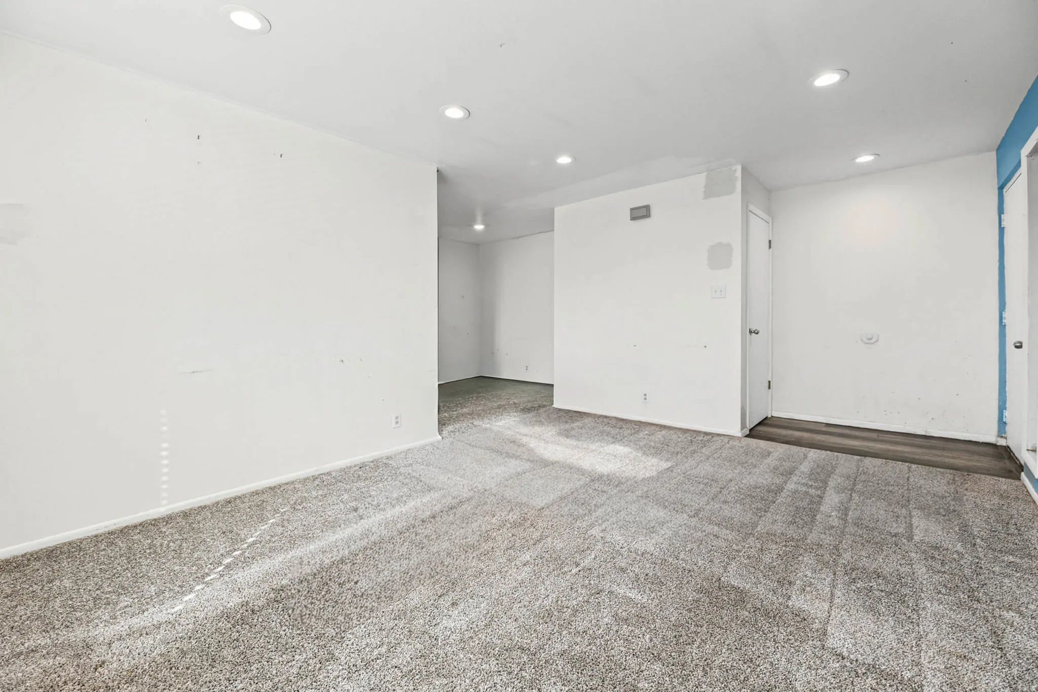 Unfurnished room with recessed lighting and carpet flooring
